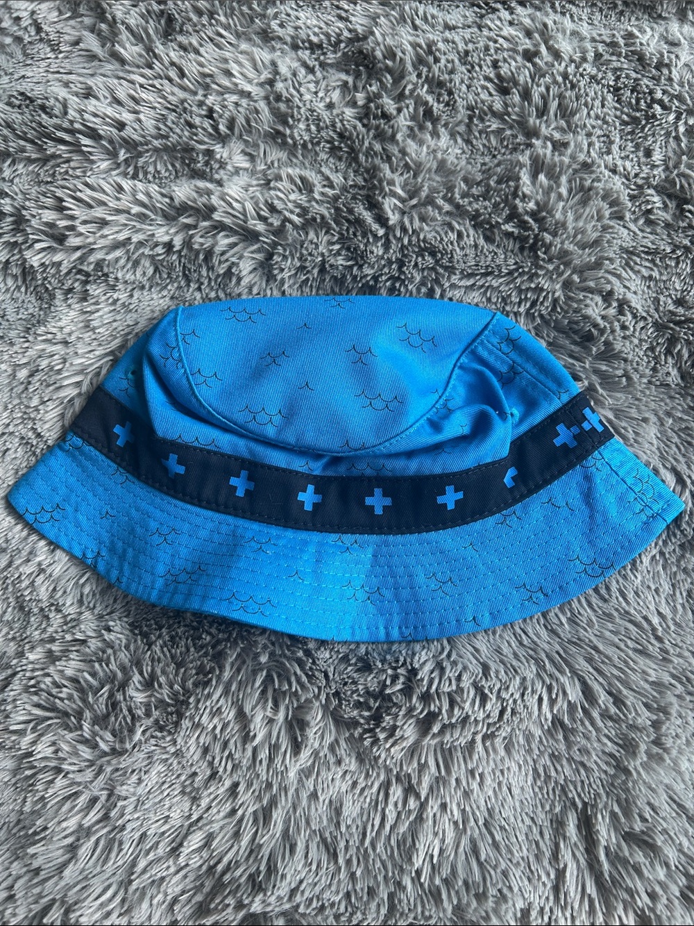 Pink dolphins.Blue Bucket Hat with Subtle Wave Accents
